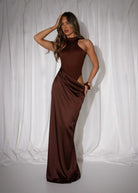 Women's brown maxi dress with built in brown bodysuit and racer style neckline and satin skirt starting at waistline. Cut out detail on the thigh and maxi length skirt. 