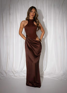Women's brown maxi dress with built in brown bodysuit and racer style neckline and satin skirt starting at waistline. Cut out detail on the thigh and maxi length skirt. 